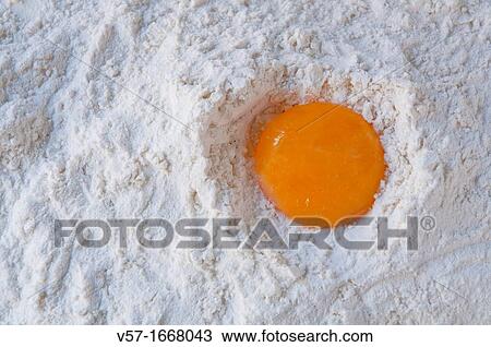 Egg yolk on flour View Large Photo Image Stock Image - Egg yolk on flour. Fotosearch