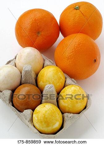 Eggs colored with oranges View Large Photo Image Stock Photo - Eggs colored with oranges. Fotosearch