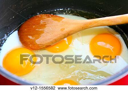 Eggs yolks in a fryer View Large Photo Image Stock Image - Eggs yolks in a fryer. Fotosearch