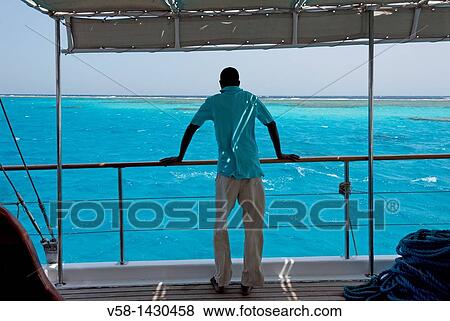 Egypt, Marsa Alam region, Aboard Cruise ship? La Vela?, Crewman View Large Photo Image Stock Photo - Egypt, Marsa Alam region, Aboard Cruise ship? La Vela?, Crewman. Fotosearch