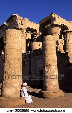 EGYPT, NILE RIVER, KOM OMBO TEMPLE, COLUMNS WITH LOCAL MAN. View Large Photo Image Stock Photo - EGYPT, NILE RIVER, KOM OMBO TEMPLE, COLUMNS WITH LOCAL MAN.. Fotosearch