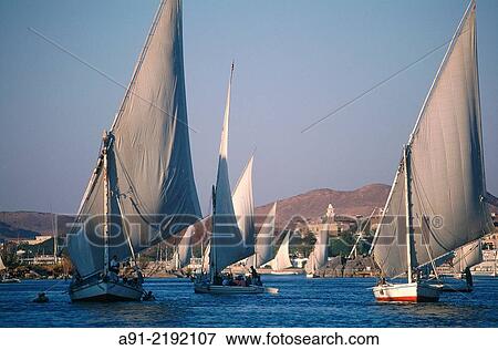 EGYPT. NUBIA. ASWAN. FELUCCAS ON RIVER NILE AT DUSK. View Large Photo Image Stock Photo - EGYPT. NUBIA. ASWAN. FELUCCAS ON RIVER NILE AT DUSK.. Fotosearch