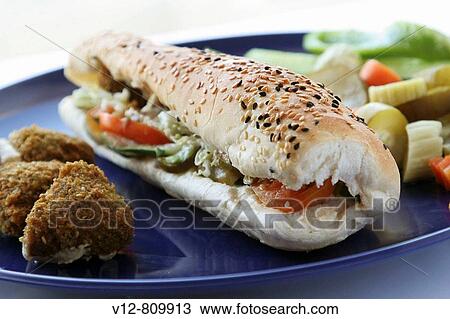 Egyptian food, Falafel, Fritters of Broad Beans and green vegetables View Large Photo Image Stock Image - Egyptian food, Falafel, Fritters of Broad Beans and green vegetables. Fotosearch