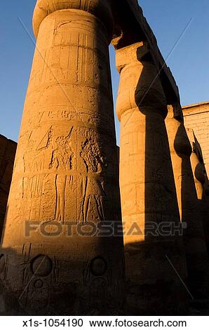 Stock Image - Egyptian hieroglyphs carved into limestone. Fotosearch