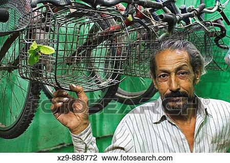 Egyptian man in his shop for renting bycicles inside Siwa Oasis View Large Photo Image Stock Image - Egyptian man in his shop for renting bycicles inside Siwa Oasis. Fotosearch