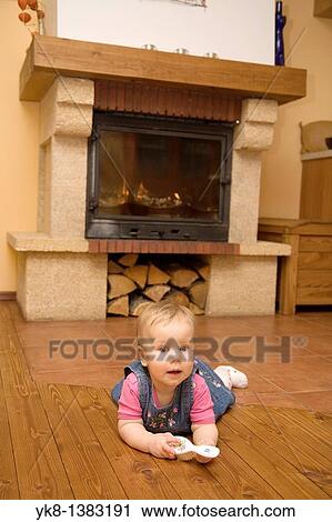Eight-Month baby crawling by the fireplace in the kitchen View Large Photo Image Stock Image - Eight-Month baby crawling by the fireplace in the kitchen. Fotosearch