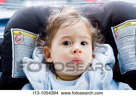 Eight month old infant boy in a car portrait View Large Photo Image Picture - Eight month old infant boy in a car portrait. Fotosearch