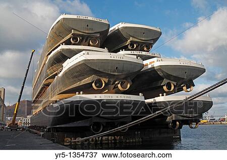 Eight new boats stacked on platform being towed from shipyard in China to Europe Puerto de La Luz, Las Palmas, Gran Canaria, Canary Islands, Spain View Large Photo Image Stock Photo - Eight new boats stacked on platform being towed from shipyard in China to Europe Puerto de La Luz, Las Palmas, Gran Canaria, Canary Islands, Spain. Fotosearch