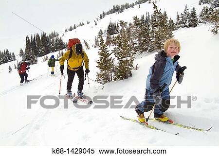 eight year old boy skis with a group in Banff National Park, Alberta, Canada View Large Photo Image Stock Photography - eight year old boy skis with a group in Banff National Park, Alberta, Canada. Fotosearch