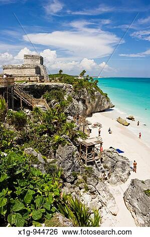 El Castillo The Castle and rocky beach with sunbathers at the Mayan ruins of Tulum in Quintana Roo, Mexico View Large Photo Image Stock Photograph - El Castillo The Castle and rocky beach with sunbathers at the Mayan ruins of Tulum in Quintana Roo, Mexico. Fotosearch