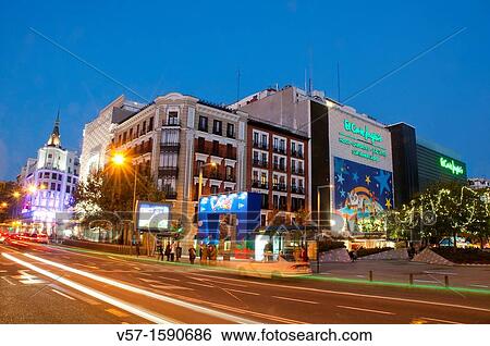 Stock Photograph - El Corte Ingles at Christmas, viewed from Narvaez street, night view. Madrid, Spain.. Fotosearch