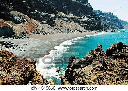 El Hierro, Canary Islands The red black volcanic sand beach of the Playa del Verodal is the largest on the island View Large Photo Image Stock Photograph - El Hierro, Canary Islands The red black volcanic sand beach of the Playa del Verodal is the largest on the island. Fotosearch