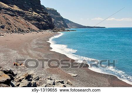 El Hierro, Canary Islands The red black volcanic sand beach of the Playa del Verodal is the largest on the island View Large Photo Image Stock Photography - El Hierro, Canary Islands The red black volcanic sand beach of the Playa del Verodal is the largest on the island. Fotosearch