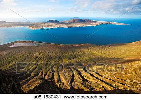 El Mirador del Rio, one of the arquitectonic creations of Cesar Manrique From here, we can contemplate the Chinijo Archipelago Nature Rerserve, Island of La Graciosa Lanzarote Canary Islands Spain. View Large Photo Image Stock Image - El Mirador del Rio, one of the arquitectonic creations of Cesar Manrique From here, we can contemplate the Chinijo Archipelago Nature Rerserve, Island of La Graciosa Lanzarote Canary Islands Spain.. Fotosearch