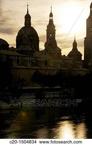 El Pilar Basilica, and its reflections in Ebro river, skyline, at night, Zaragossa, Aragon, Spain View Large Photo Image Picture - El Pilar Basilica, and its reflections in Ebro river, skyline, at night, Zaragossa, Aragon, Spain. Fotosearch
