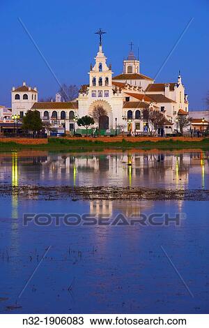 El Rocio village and Hermitage at Dusk, Almonte El Rocio, El Roc? o Marismas de Doana, Doana National Park, Huelva province, Andalusia Spain View Large Photo Image Stock Image - El Rocio village and Hermitage at Dusk, Almonte El Rocio, El Roc? o Marismas de Doana, Doana National Park, Huelva province, Andalusia Spain. Fotosearch