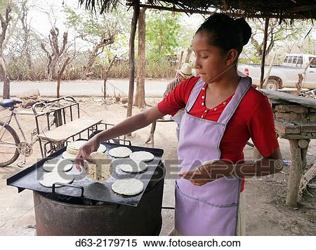 Stock Photography - El Salvador. COMUS projects. Making tortillas.. Fotosearch