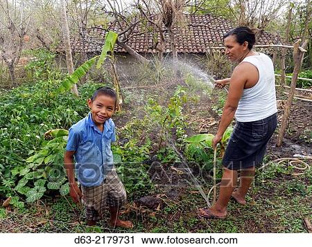 El Salvador. JDS projects in Jujutla. Family of Jose Alberto Garcia (41) and his wife Ana Arely Gonzalez (33) and their five children, Clarissa (17), Nidia (16), Celia (13), Katherine (10) and Emerson (7), village of El Nance. View Large Photo Image Stock Image - El Salvador. JDS projects in Jujutla. Family of Jose Alberto Garcia (41) and his wife Ana Arely Gonzalez (33) and their five children, Clarissa (17), Nidia (16), Celia (13), Katherine (10) and Emerson (7), village of El Nance.. Fotosearch