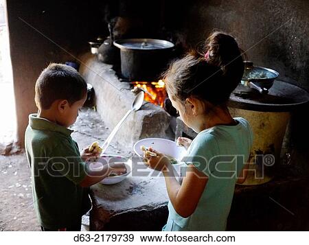 Stock Photo - El Salvador. JDS projects in Jujutla. Family of Jose Alberto Garcia (41) and his wife Ana Arely Gonzalez (33) and their five children, Clarissa (17), Nidia (16), Celia (13), Katherine (10) and Emerson (7), village of El Nance.. Fotosearch