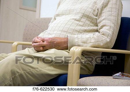 Elder man in waiting room of medical office. View Large Photo Image Stock Image - Elder man in waiting room of medical office.. Fotosearch