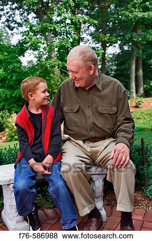 Elder, senior man having a talk with his grandson. View Large Photo Image Stock Photo - Elder, senior man having a talk with his grandson.. Fotosearch
