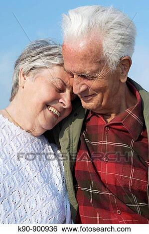 Elderly caucasian couple holding each other, Island of Amrum, Northfrisian, Schleswig_Holstein, Northern Germany, Europe View Large Photo Image Stock Photograph - Elderly caucasian couple holding each other, Island of Amrum, Northfrisian, Schleswig_Holstein, Northern Germany, Europe. Fotosearch