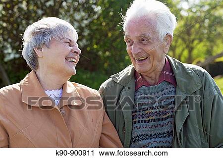 Elderly caucasian couple looking and laughing at each other, Island of Amrum, Northfrisian, Schleswig_Holstein, Northern Germany, Europe View Large Photo Image Stock Image - Elderly caucasian couple looking and laughing at each other, Island of Amrum, Northfrisian, Schleswig_Holstein, Northern Germany, Europe. Fotosearch