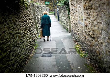 Elderly lady walking View Large Photo Image Stock Image - Elderly lady walking. Fotosearch
