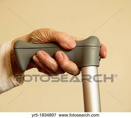 Elderly lady's hand on walking stick View Large Photo Image Stock Photo - Elderly lady's hand on walking stick. Fotosearch