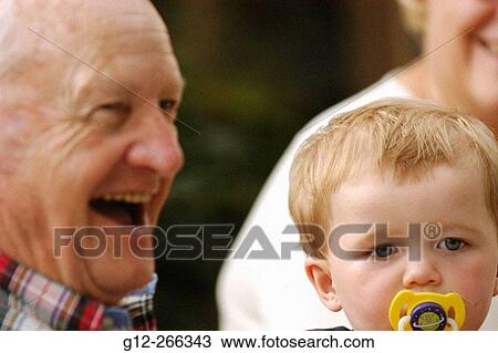 Elderly man and toddler View Large Photo Image Stock Image - Elderly man and toddler. Fotosearch