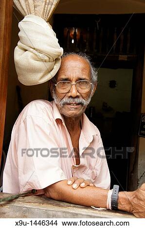 elderly man at the window inside the historic Fort in Galle, Sri Lanka View Large Photo Image Picture - elderly man at the window inside the historic Fort in Galle, Sri Lanka. Fotosearch