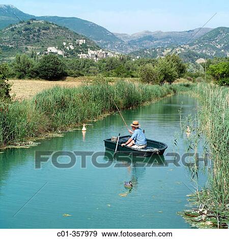 Elderly man fishing from row boat in a river. Dr? me, Provence. France. View Large Photo Image Stock Photo - Elderly man fishing from row boat in a river. Dr? me, Provence. France.. Fotosearch