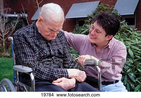 Elderly man with caretaker View Large Photo Image Picture - Elderly man with caretaker. Fotosearch