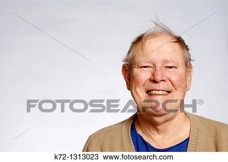 Stock Image - Elderly man with funny hairdo. Fotosearch