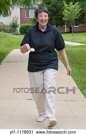 Elderly woman age 77 competing in the egg on spoon race in a Senior Olympics competition between several retirement, called the Friendship Games Held at Quadrangle, a continuing care facility in Haverford, Pennsylvania View Large Photo Image Stock Image - Elderly woman age 77 competing in the egg on spoon race in a Senior Olympics competition between several retirement, called the Friendship Games Held at Quadrangle, a continuing care facility in Haverford, Pennsylvania. Fotosearch