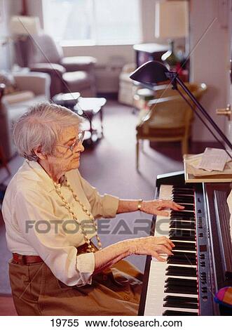 Elderly woman playing the piano View Large Photo Image Stock Photography - Elderly woman playing the piano. Fotosearch