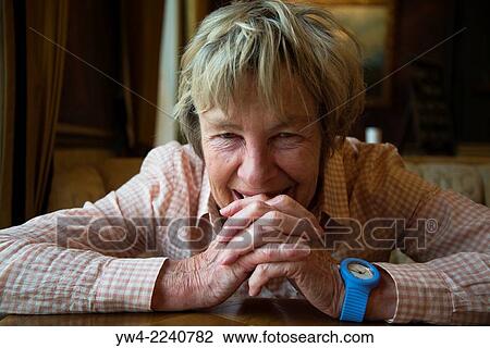 Elderly woman with clasped hands smiling. View Large Photo Image Stock Image - Elderly woman with clasped hands smiling.. Fotosearch