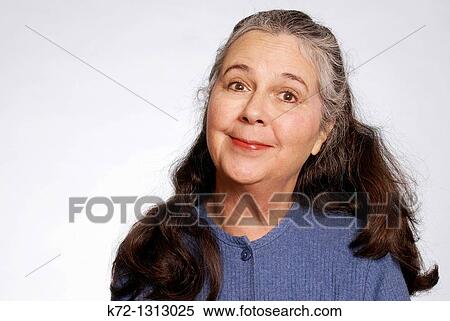 Stock Photography - Elderly woman with smirk on her face. Fotosearch