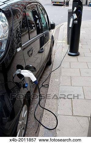 Stock Photo - Electric car charging station or charging point Marylebone central London England Britain UK Europe.. Fotosearch