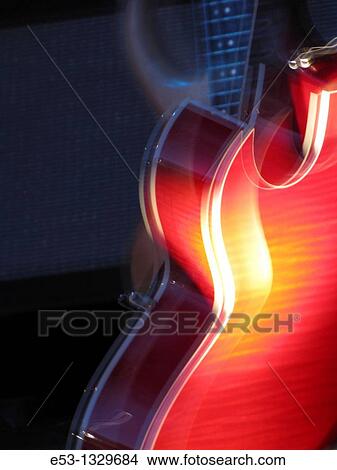 Electric guitar glowing red View Large Photo Image Picture - Electric guitar glowing red. Fotosearch