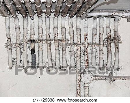 Electrical conduits or pipes, galvanised pipes on a brick wall Pune, Maharashtra, India View Large Photo Image Stock Photo - Electrical conduits or pipes, galvanised pipes on a brick wall Pune, Maharashtra, India. Fotosearch