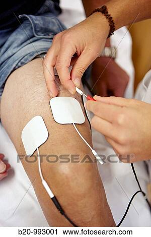 Stock Image - Electrical muscle stimulation, rebahilitation. Policlinica Gipuzkoa, San Sebastian, Donostia, Euskadi, Spain. Fotosearch