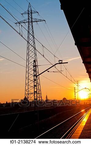 electrical tower next to the railway station at sunset in San Jeronimo in Seville View Large Photo Image Picture - electrical tower next to the railway station at sunset in San Jeronimo in Seville. Fotosearch