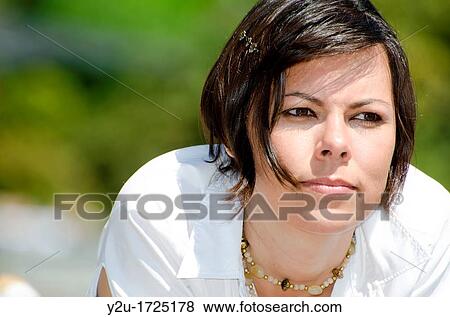 Elegant and smiling woman with white shirt View Large Photo Image Stock Photo - Elegant and smiling woman with white shirt. Fotosearch
