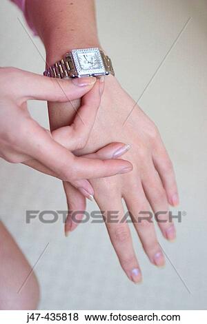 Elegant hands touching a diamond encrusted watch View Large Photo Image Stock Photo - Elegant hands touching a diamond encrusted watch. Fotosearch