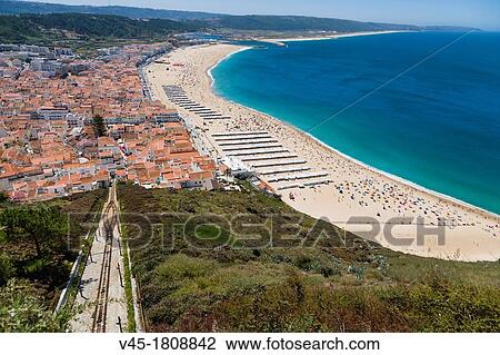 Elevador, Ascensor da Nazare, Funicular railway and Beach, Praia, seen from Sitio, old village, Nazare, Oeste, Leiria District, Portugal. View Large Photo Image Stock Image - Elevador, Ascensor da Nazare, Funicular railway and Beach, Praia, seen from Sitio, old village, Nazare, Oeste, Leiria District, Portugal.. Fotosearch