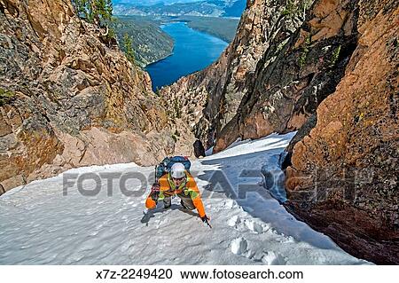 Elijah Weber climbing the Chockstone Couloir, AKA the Boy Scout Couloir an alpine route which is rated Grade 3, Class 4 and located on The Grand Mogul in the Sawtooth Mountains in central Idaho. View Large Photo Image Stock Image - Elijah Weber climbing the Chockstone Couloir, AKA the Boy Scout Couloir an alpine route which is rated Grade 3, Class 4 and located on The Grand Mogul in the Sawtooth Mountains in central Idaho.. Fotosearch