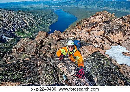 Elijah Weber climbing the Chockstone Couloir, AKA the Boy Scout Couloir an alpine route which is rated Grade 3, Class 4 and located on The Grand Mogul in the Sawtooth Mountains in central Idaho. View Large Photo Image Stock Image - Elijah Weber climbing the Chockstone Couloir, AKA the Boy Scout Couloir an alpine route which is rated Grade 3, Class 4 and located on The Grand Mogul in the Sawtooth Mountains in central Idaho.. Fotosearch