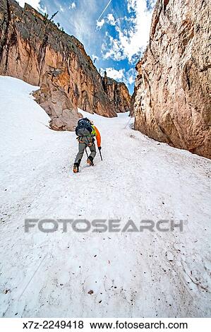 Elijah Weber climbing the Chockstone Couloir, AKA the Boy Scout Couloir an alpine route which is rated Grade 3, Class 4 and located on The Grand Mogul in the Sawtooth Mountains in central Idaho. View Large Photo Image Stock Photo - Elijah Weber climbing the Chockstone Couloir, AKA the Boy Scout Couloir an alpine route which is rated Grade 3, Class 4 and located on The Grand Mogul in the Sawtooth Mountains in central Idaho.. Fotosearch