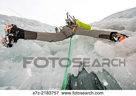 Elijah Weber ice climbing a route called Genesis 1 which is rated WI-4 and located in Hyalite Canyon in the Gallatin Mountains near the city of Bozeman in southern Montana. View Large Photo Image Stock Photo - Elijah Weber ice climbing a route called Genesis 1 which is rated WI-4 and located in Hyalite Canyon in the Gallatin Mountains near the city of Bozeman in southern Montana.. Fotosearch